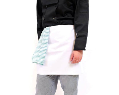 person wearing white 4 way bar apron with pattered tea towel