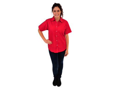 A woman wearing a red ihop hostess shirt and black pants