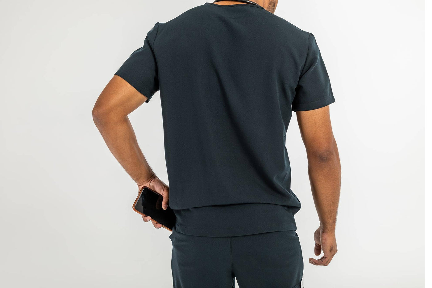 Vena mens jogger scrub pants man using side pocket placing his mobile#colour_black