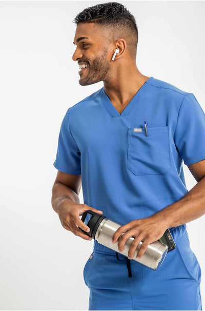 VENA mens jogger style scrub shirts, man holding water bottle#colour_royal-blue