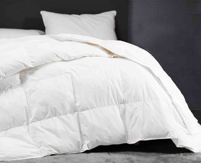 luxury cotton shell duvet on the bed with hypoallergenic pillow#colour_white