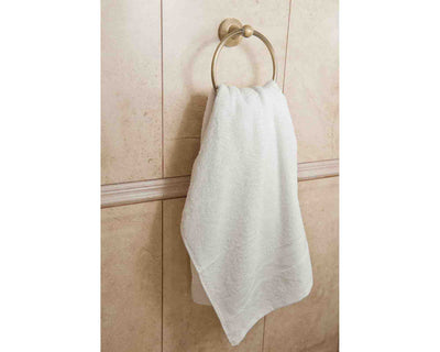 White Hand towel hanging on towel ring.