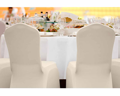 2 chairs with ivory spandex chair covers