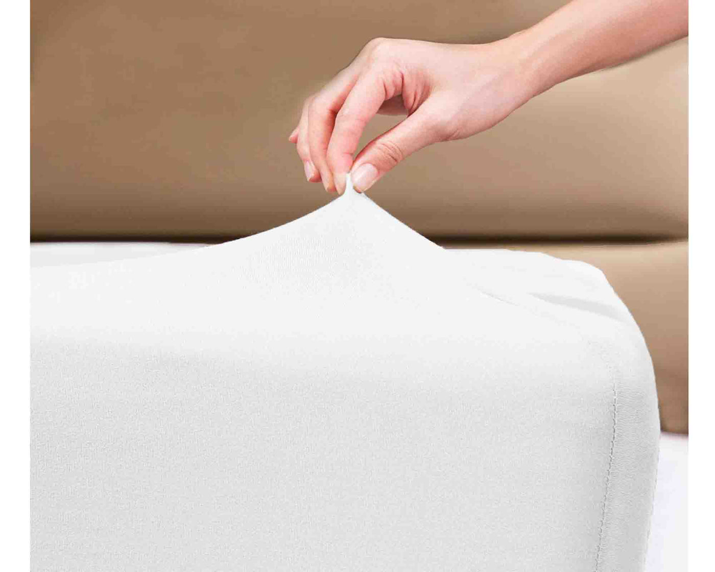 White Knitted fitted sheet on a mattress 