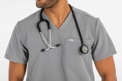 VENA™ MENS Jogger Style Scrub Shirts zoom image of shirt with stethoscope on his neck#colour_grey