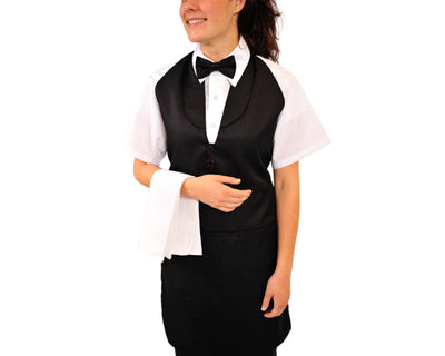 lady wearing black tuxedo apron with bow tie holding white napkin