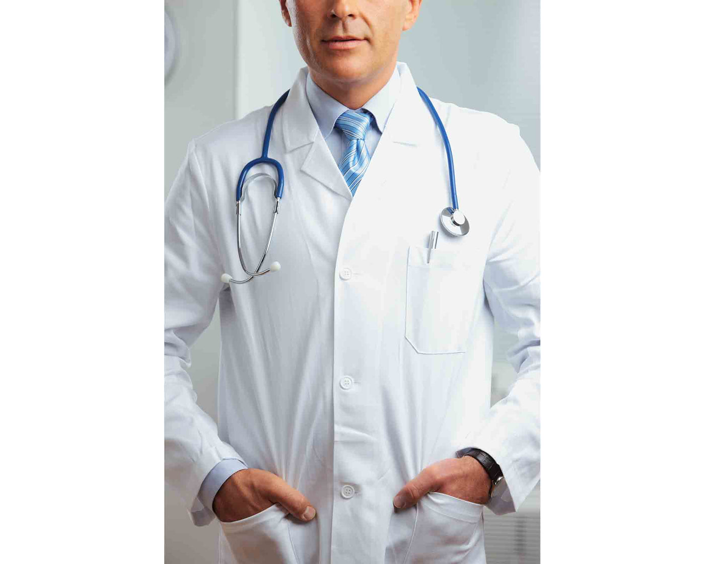 man wearing unisex white lab coat with stethoscope on his shoulder