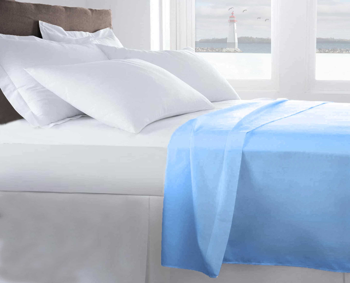 light blue T200 flat sheet laying on a hotel bed with pillows#colour_light-blue