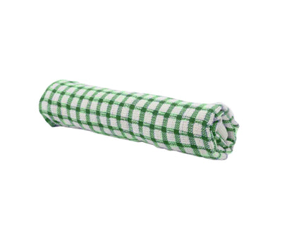 rolled green patterned tea towel with white background