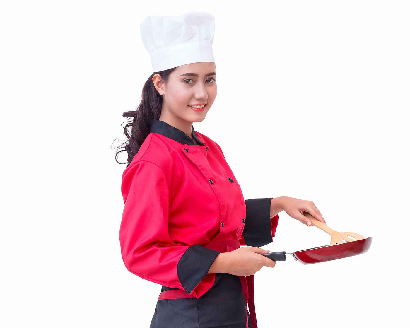 lady wearing red chef coat with black trim with white chef hat on her head holding frying pan#colour_red